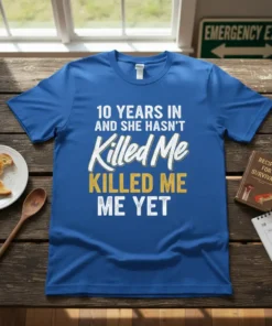 Funny anniversary t-shirt with the quote "10 Years In And She Hasn't Killed Me Killed Me Me Yet" in white