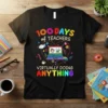 Black t-shirt with colorful text "100 DAYS of TEACHERS VIRTUALLY DOING ANYTHING" and graphics of a laptop, mask, and coffee