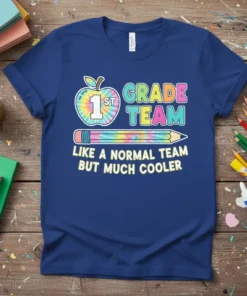 1st Grade Team Like A Normal Team But Much Cooler text design with apple and pencil graphics on a blue