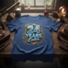 Anniversary t-shirt with "24 YEARS LATER" text in metallic silver and gold, surrounded by gears and geometric patterns