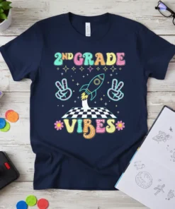 2nd Grade Vibes t-shirt with retro fonts, a rocket ship, peace signs, and stars. Features colorful text and playful graphics
