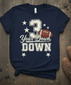 Navy blue t-shirt with "3 Year Down" text, number 3, and a football graphic with stars