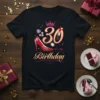 Black t-shirt with "30 It's My Birthday" text, crown, red high heel shoe, lipstick, and jewels graphic