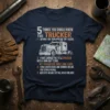 Navy blue t-shirt with bold orange and white text listing "5 Things You Should Know This Trucker" and five key