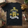 Black t-shirt with "5TH GRADE class of 2023 NAILED IT!" text, graduation cap, and thumbs-up graphics