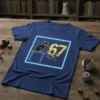 A navy blue t-shirt featuring a 67 cat design with a black cat on a table and gold numbers