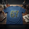T-shirt with large "67" design featuring gold trim and colorful gems, set on a blueprint background