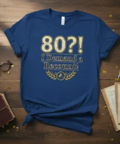 Blue t-shirt with "80?! I Demand a Recount!" in gold text, featuring a gavel graphic