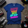 Bold neon text graphic "80's Made 90's Hip Hop Raised" on a royal blue t-shirt, representing 80s and 90s music