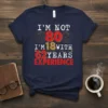 T-shirt with the text "I'm Not 80 I'm 18 With 62 Years Experience" in distressed vintage font with fireworks graphics