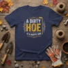 A Dirty Hoe Is A Happy Hoe quote on a navy t-shirt, featuring vintage distressed typography and gardening tool graphics
