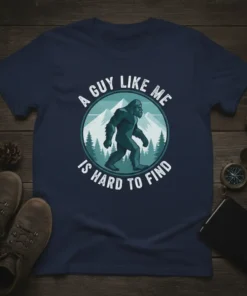Navy blue t-shirt featuring "A Guy Like Me Is Hard To Find" text around a Bigfoot graphic in a forest