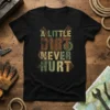 A Little Dirt Never Hurt quote on a black t-shirt, with grunge typography and gear graphics