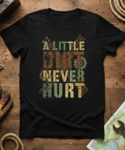 A Little Dirt Never Hurt quote on a black t-shirt, with grunge typography and gear graphics