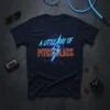 A Little Ray Of Pitch Black text in neon blue and orange on a dark t-shirt with a lightning bolt