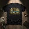 Black t-shirt with "Acting Is My Jam" text in a marquee-style design with yellow lights