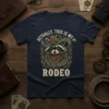 Actually, This Is My 1st Rodeo text with a cowboy raccoon graphic and western embellishments on a navy t-shirt