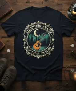 Adventure Awaits Music Under The Stars text with acoustic guitar, moon, and forest graphic on a t-shirt