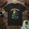 T-shirt with "ADVENTURE AWAITS" text above a graphic of a camping otter holding a lantern
