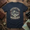 Adventure Wild Free Buddies text with mountain, boots, and trees graphic on a navy blue t-shirt