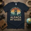 Adventure You Say Alpaca My Bags text with a llama wearing sunglasses and a mountain sunset graphic on a navy