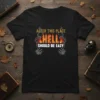 Black t-shirt with bold text "AFTER THIS PLACE HELL SHOULD BE EASY" and fiery "HELL" graphic with skeleton hands