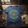 Navy blue t-shirt with gold and teal text "All My Heroes Fight Colonizers" in a circular design, featuring a central