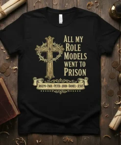 Black t-shirt with gold text "All My Role Models Went To Prison" and a cross with a crown of thorns