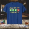 T-shirt with text "ALL OF MY ✔️ ✔️ ✔️ ❌ PARLAYS" in gold and green, celebrating betting outcomes