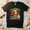 Retro Aloha Hawaii t-shirt design with a sunset, palm trees, ocean waves, and hibiscus flower