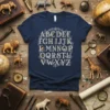 Navy t-shirt featuring a vintage-style alphabet with small animal illustrations integrated into each letter, titled Alphabet Animals ABCDEFGH IJK LMNOP
