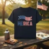 Navy t-shirt with distressed AMERICA text and a waving American flag graphic, featuring stars and stripes in patriotic colors
