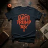 Anti Trump AF t-shirt with a shield graphic and raised fist in orange distressed font