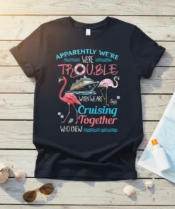 Apparently We're Trouble When We Are Cruising Together Who Knew! text with flamingos and cruise ship graphic on a navy