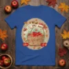 Apple Harvest t-shirt design with a wooden basket full of red apples and falling autumn leaves