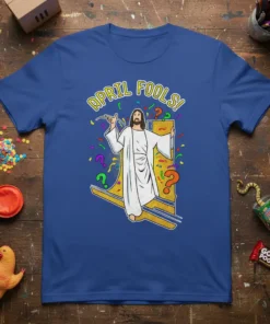 April Fools! text above a cartoon Jesus figure on a blue t-shirt, surrounded by confetti and question marks