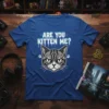 Are You Kitten Me? text with a geometric gray cat face and paw prints graphic on a blue t-shirt