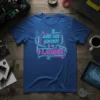Blue t-shirt with neon pink and blue text "ASK ME ABOUT i LADIES" in a circuit board design