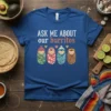 Funny "Ask Me About Our Burritos" text with illustrations of four swaddled babies on a royal blue t-shirt