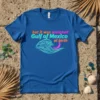 Blue t-shirt with text "but it was assigned Gulf of Mexico at birth" and a neon wave graphic, representing Gulf