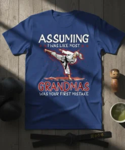 T-shirt with "Assuming I Was Like Most Grandmas Was Your First Mistake" text and karate action graphic for grandmas