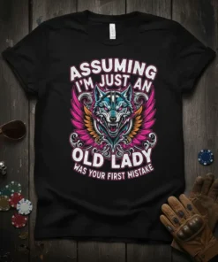 T-shirt with "Assuming I'm Just An Old Lady Was Your First Mistake" text and a fierce wolf with wings graphic
