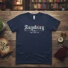 Navy blue t-shirt featuring "Augsburg GERMANY" in white gothic-style font with a red dot accent