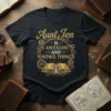 T-shirt with gold text "Aunt Jen Is Awesome and Knows Things" above an open book and gears graphic