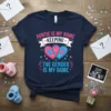 Auntie is my name keeping the gender is my game text and pink/blue hearts with baby footprints graphic on navy