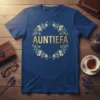 Auntiefa text in gold foil surrounded by a floral wreath on a navy blue t-shirt
