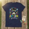 Autism grandma t-shirt design with puzzle piece graphics and a woman's messy bun hairstyle wearing sunglasses