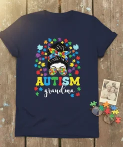 Autism grandma t-shirt design with puzzle piece graphics and a woman's messy bun hairstyle wearing sunglasses