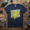 Autism Is My Super Power t-shirt with bold yellow and blue comic-style text on a navy shirt