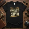 Black t-shirt with "AWESOME SINCE 2010" text in vintage gold and eagle graphic